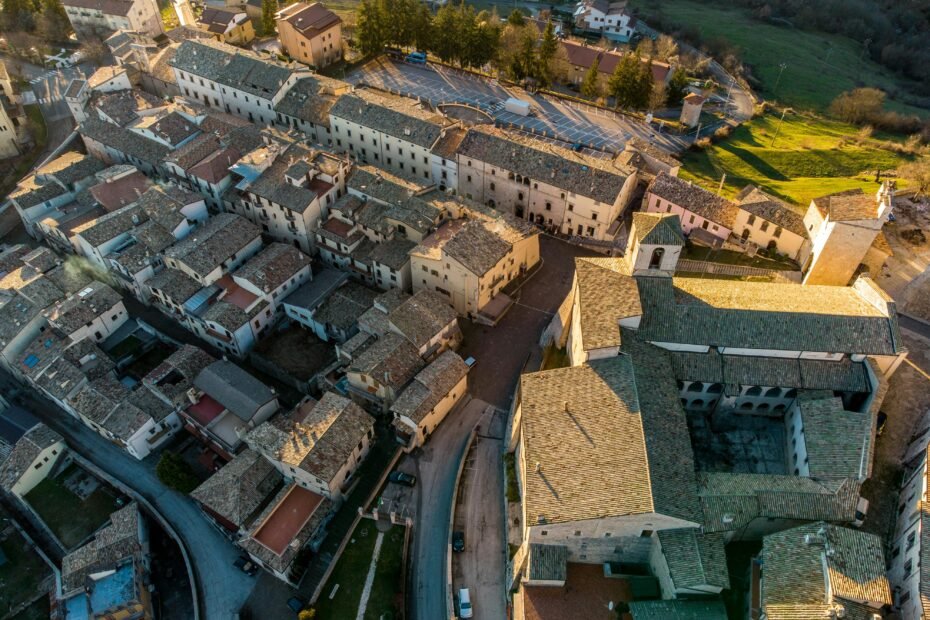 Panoramic view over the rooftops of a historic European city at sunset, illustrating one of the best cities to travel to in Europe for a 2025 getaway.