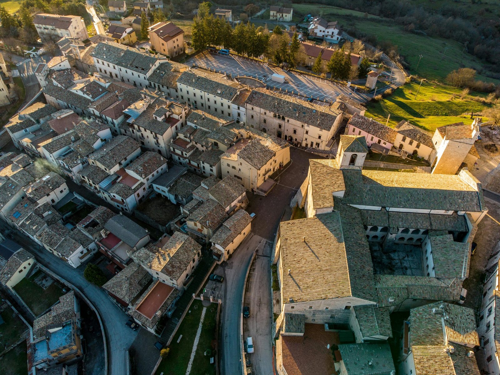 Panoramic view over the rooftops of a historic European city at sunset, illustrating one of the best cities to travel to in Europe for a 2025 getaway.