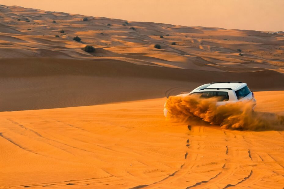 Dubai desert safari: Golden dunes at sunset with a 4x4 vehicle, capturing the essence of Arabian adventure and cultural immersion.