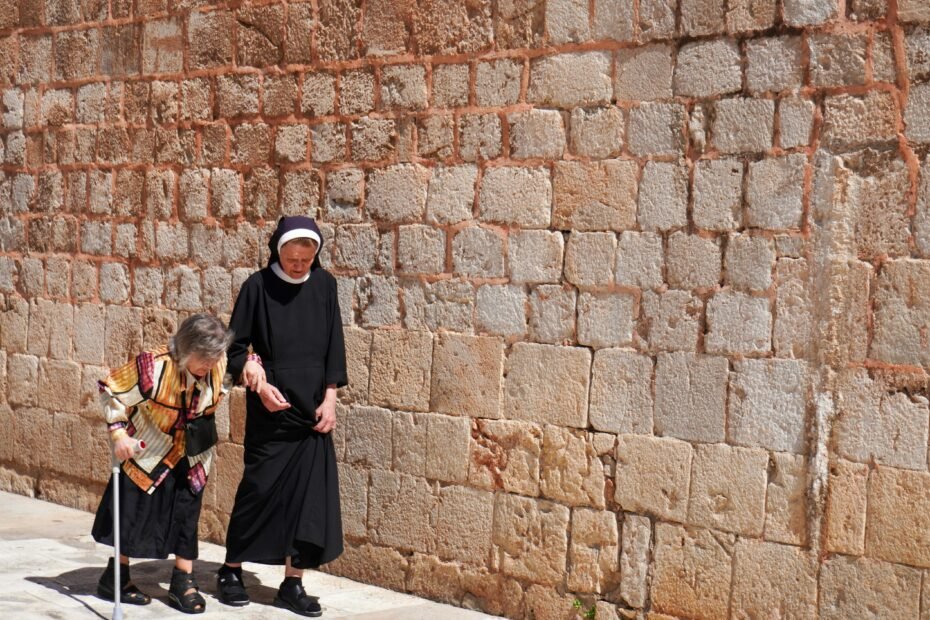 A smiling travel Certified Nursing Assistant (CNA) looking confidently at a vibrant city skyline, symbolizing career growth, financial reward, and the personal adventure of exploring new locations in healthcare.