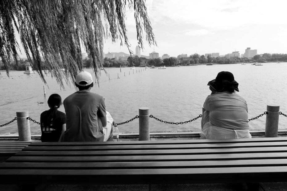 Happy parents pushing a lightweight, compact travel pram with their baby through an airport terminal, highlighting the convenience of the best travel stroller for family adventures and smooth journeys.
