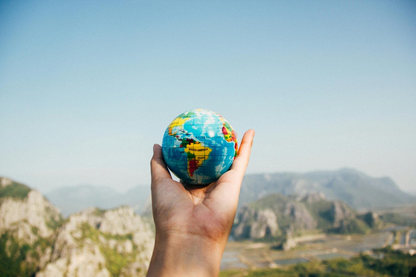A joyful traveler exploring an exotic, affordable destination, perfect for budget travel planning and finding the cheapest international trips for 2025.