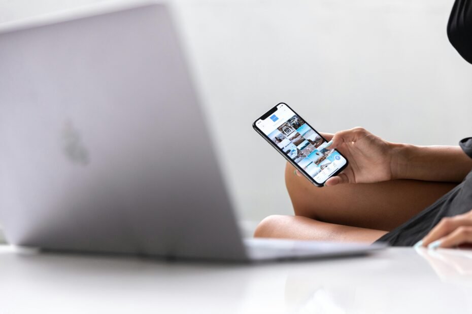 Traveler planning an authentic Bali trip using an online travel forum on a laptop, seeking community advice for an unforgettable adventure.