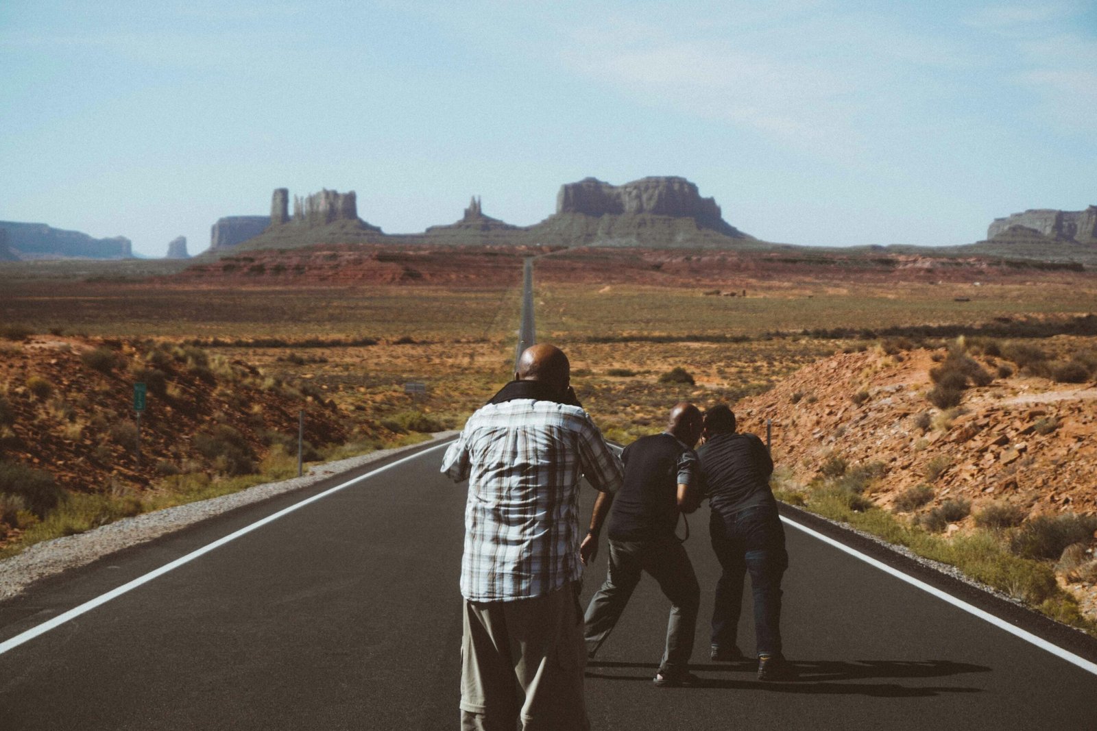A scenic view of a road winding through a vast American landscape, symbolizing the adventure of visiting cool states in the USA for a 2025 vacation.