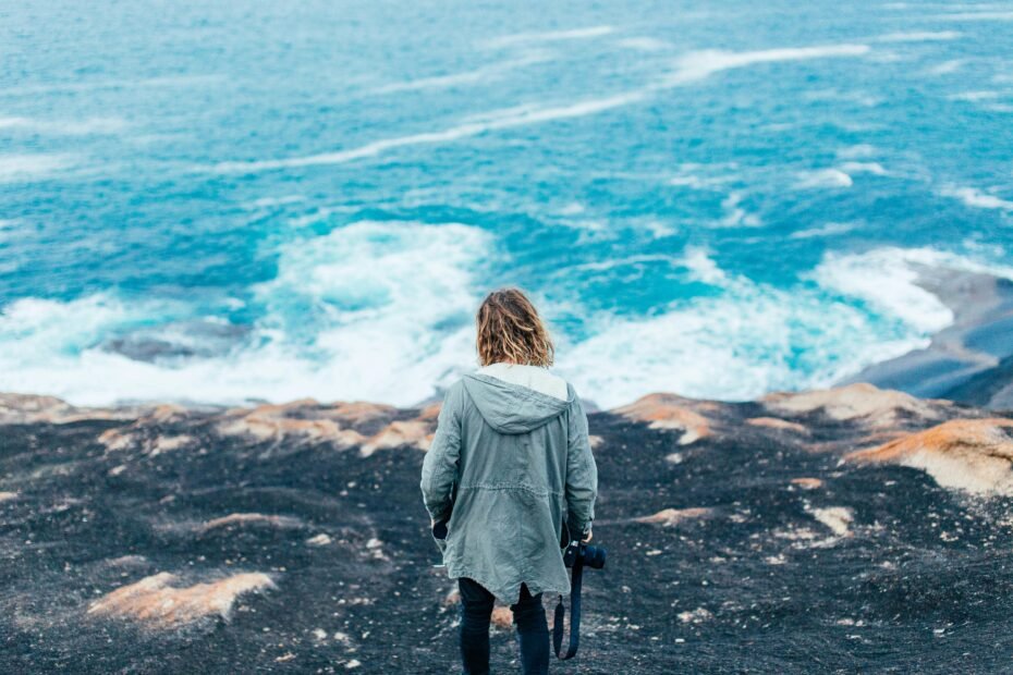 Empowered solo female traveler confidently exploring a beautiful, safe destination, perfect for women traveling alone.
