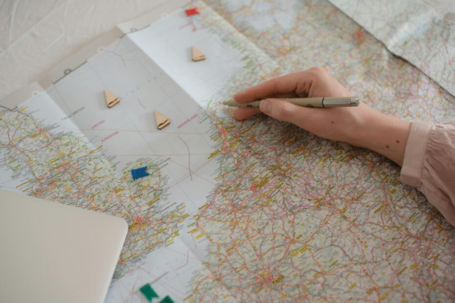 Detailed Schengen visa travel itinerary planning for a European trip with map, passport, and booking documents on a desk.