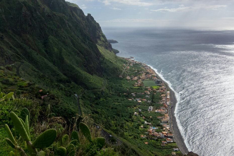 Lush green panoramic view of Madeira Island, Portugal, showcasing its year-round mild climate and stunning natural beauty for an ideal travel experience.