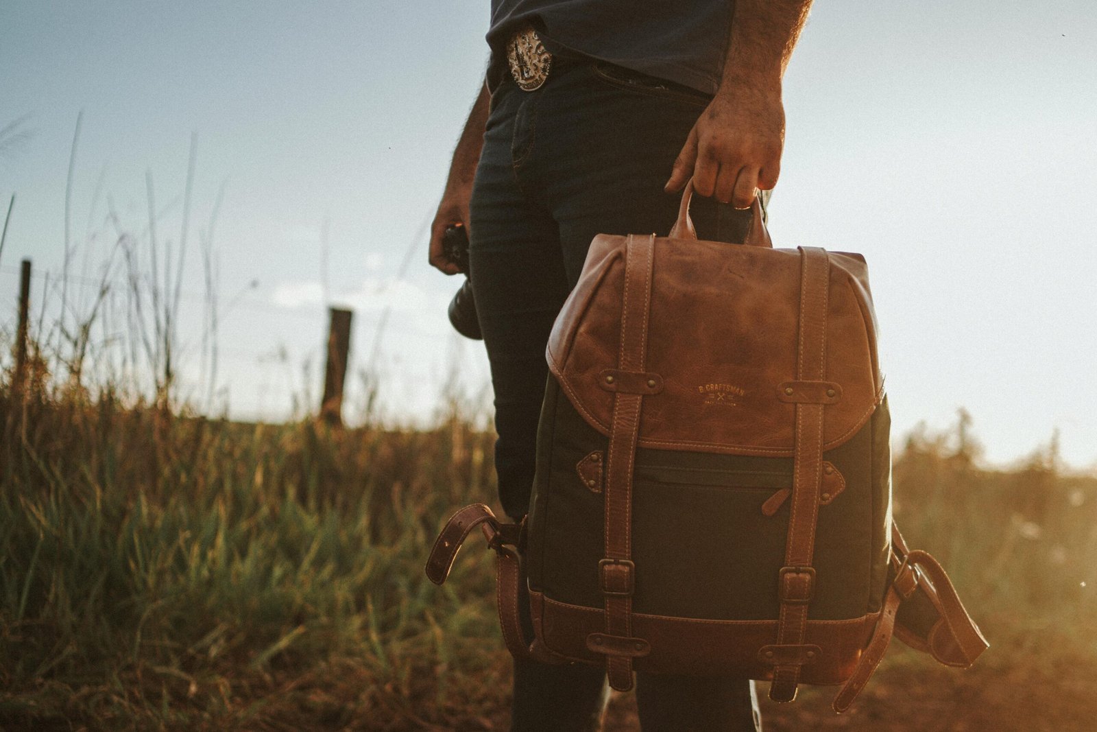 Elegant full-grain leather travel backpack on an adventure, showcasing durability and timeless style.