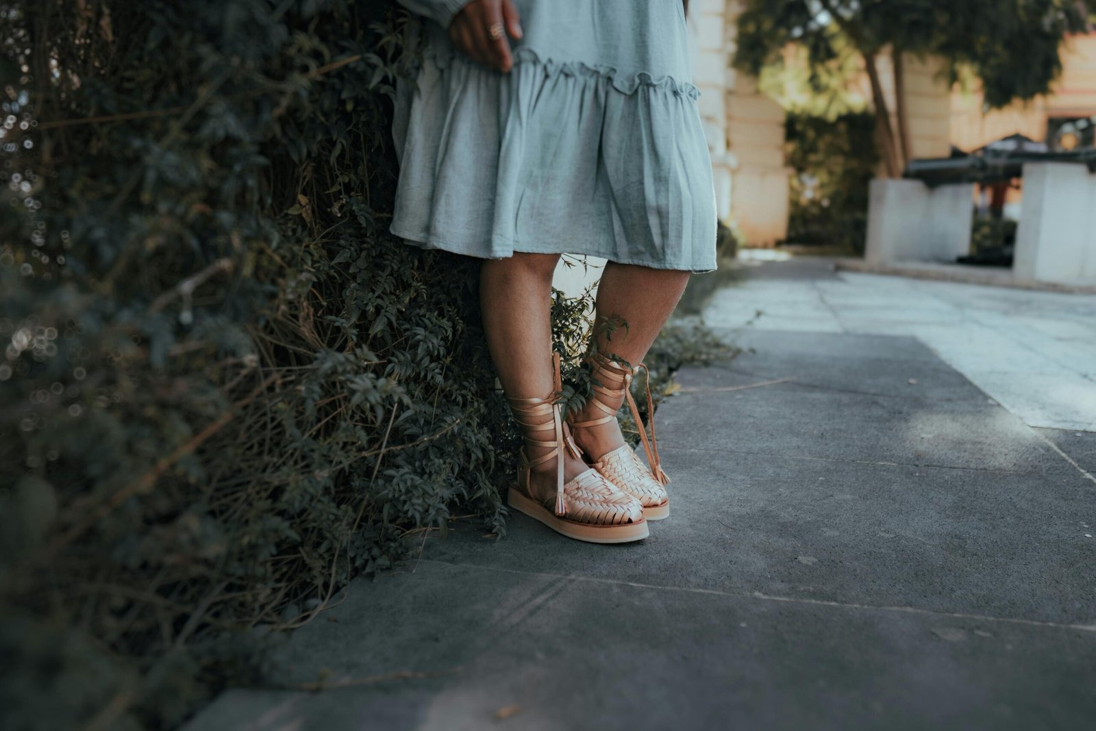 Woman wearing stylish and comfortable travel shoes for women, walking through a bustling city street, ideal for sightseeing and versatile travel.