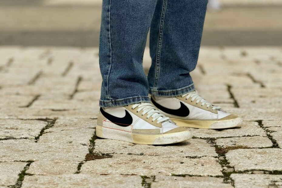 Happy traveler wearing comfortable and supportive walking shoes while exploring a picturesque city street, emphasizing enjoyable, pain-free travel.