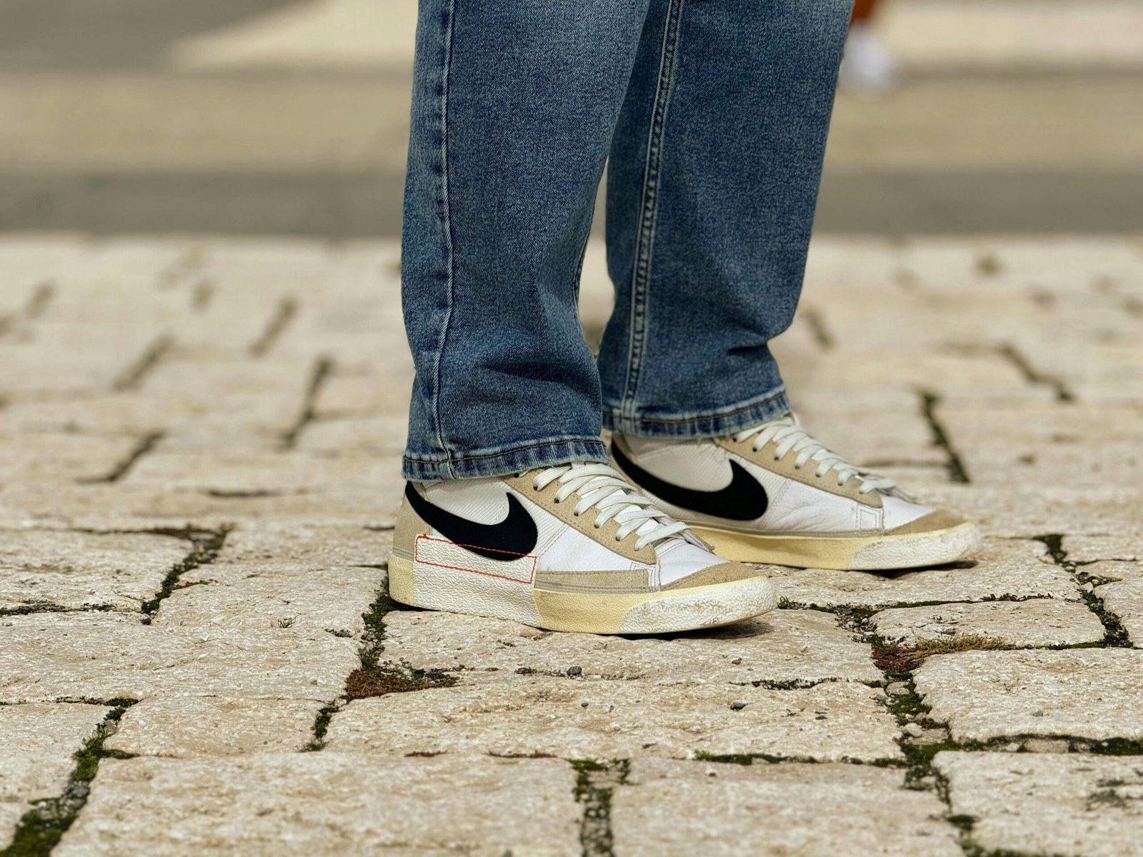 Happy traveler wearing comfortable and supportive walking shoes while exploring a picturesque city street, emphasizing enjoyable, pain-free travel.