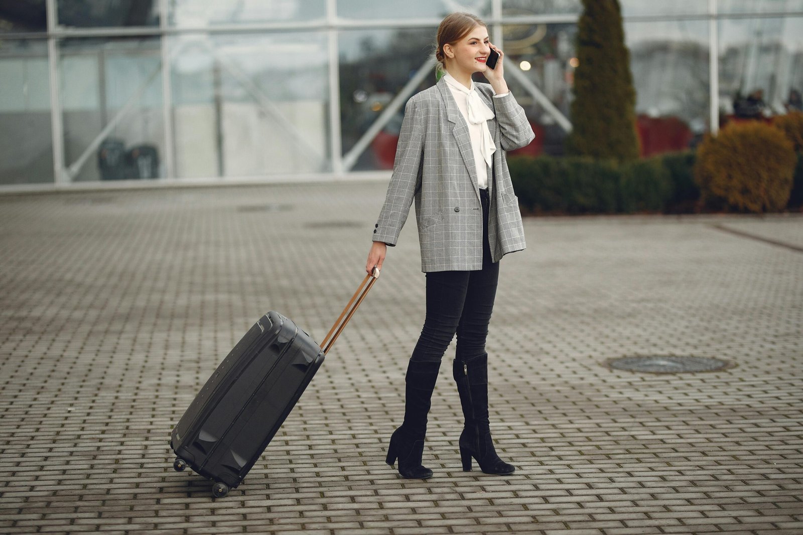 Traveler using smartphone apps for seamless trip planning and navigation in a beautiful destination.