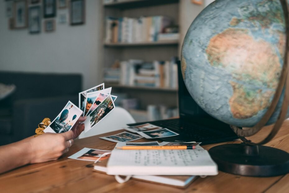 Happy travelers looking at a world map, envisioning their stress-free international dream vacation, representing the expert and personalized services of Morris Murdock Travel.