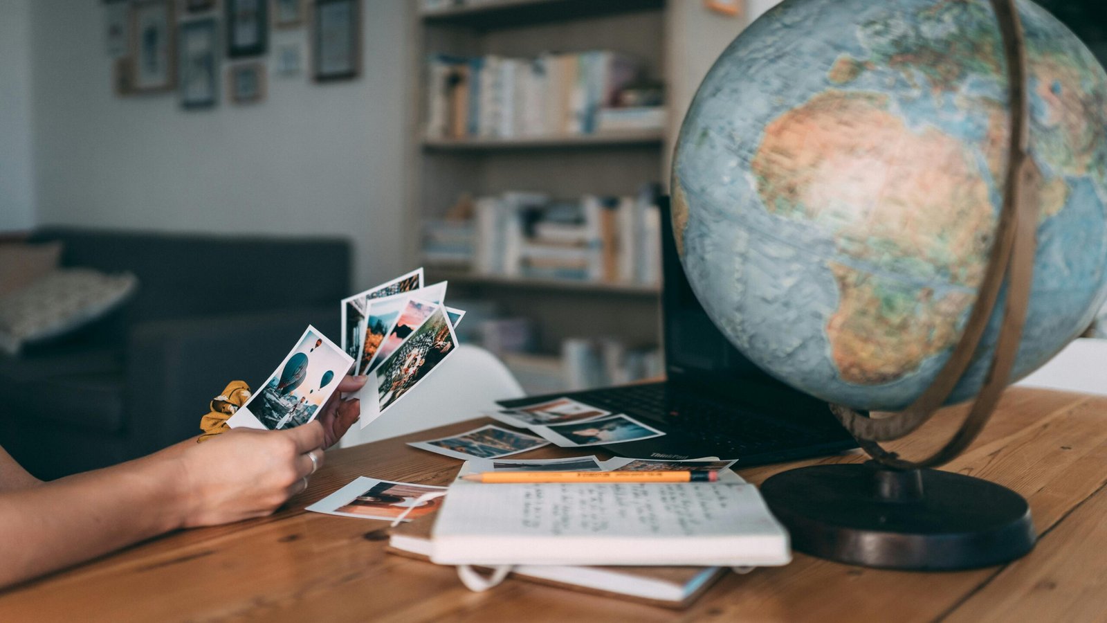 Happy travelers looking at a world map, envisioning their stress-free international dream vacation, representing the expert and personalized services of Morris Murdock Travel.