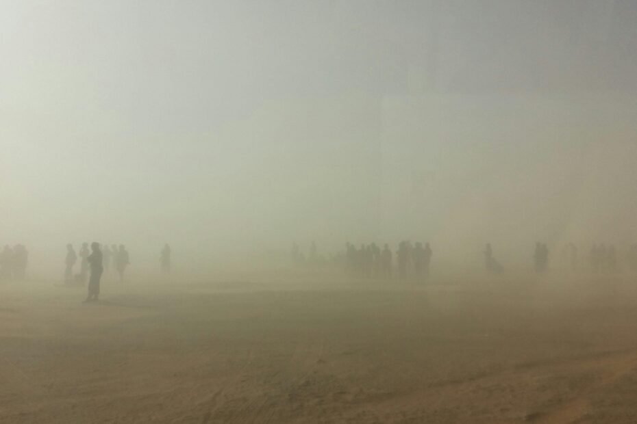 Illustrative image showing the long-distance travel of airborne respiratory droplets from a sneeze, highlighting the surprising spread of germs and its implications for public health and hygiene in indoor environments.