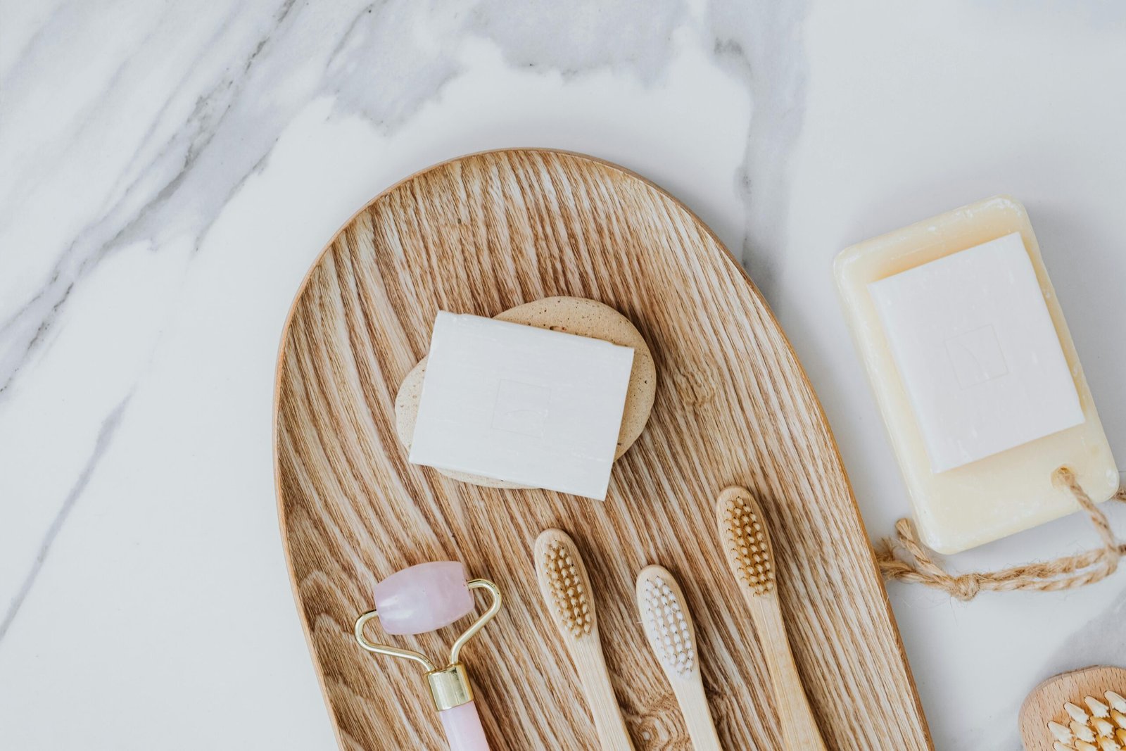 A compact travel toothbrush in its hygienic case, packed with other travel essentials, highlighting the convenience of maintaining oral hygiene on the go for travelers.