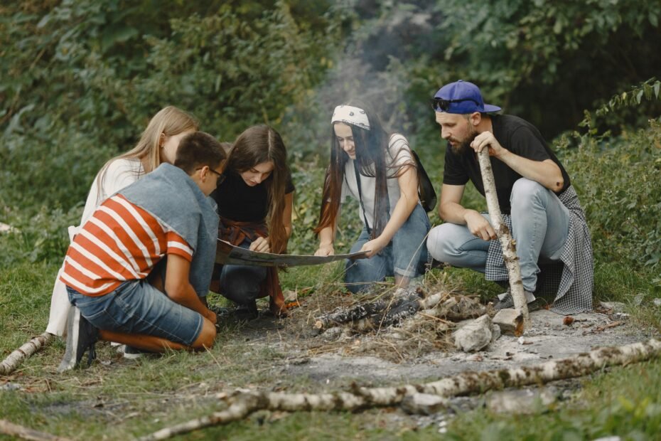 Happy group of friends or family enthusiastically planning an immersive group travel adventure, collaborating on itineraries and shared experiences for an unforgettable trip.