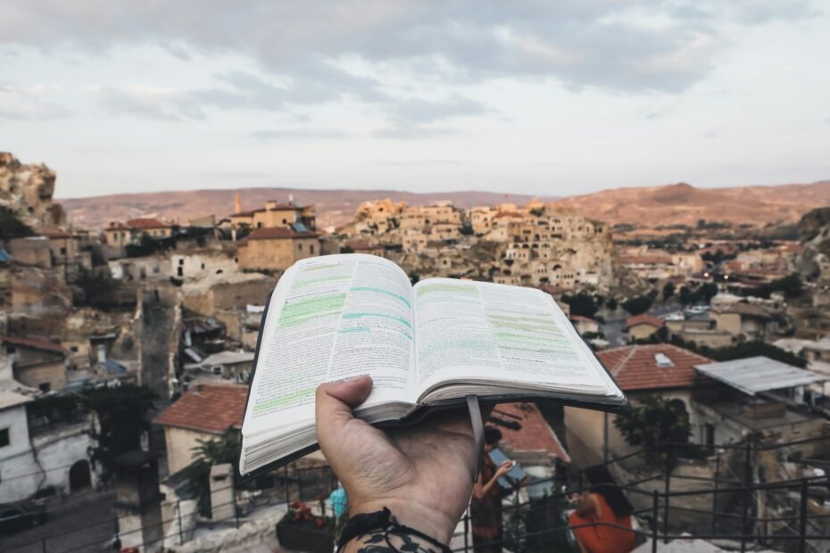 Traveler reading Bible verses for peace, guidance, and protection on a spiritual journey.