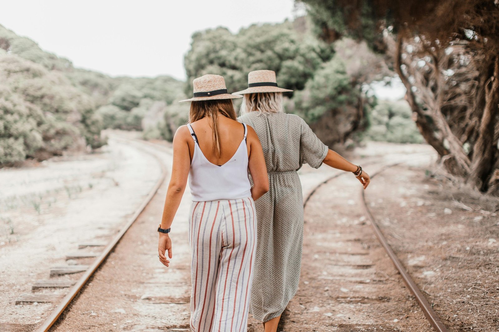 Woman wearing stylish, comfortable, and versatile travel trousers while exploring a city or natural landscape, perfect for women's adventure travel.