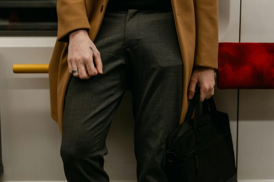 A modern traveler in versatile, stylish, and comfortable travel pants confidently navigating an urban environment. The image emphasizes the pants' sleek design, comfort, and adaptability for various travel scenarios, from active exploration to business trips.