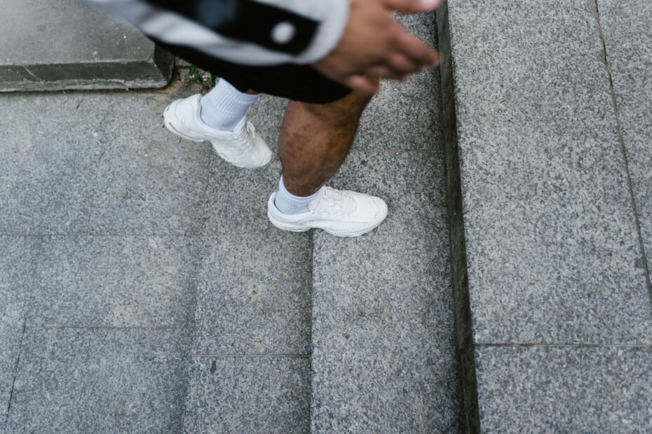 Comfortable walking shoes for travel: A person confidently explores a vibrant city street, highlighting the importance of supportive and versatile footwear for pain-free journeys.