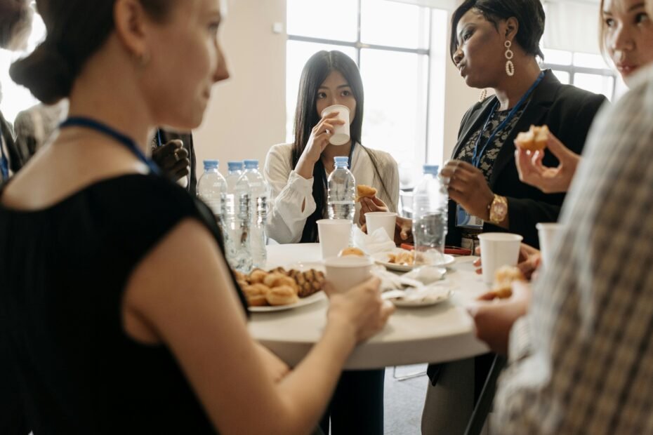 A Starbucks Coffee Traveler serving hot coffee into cups for a group at a business meeting or social event, highlighting its convenience, included items, and value for planning event budgets in 2025.