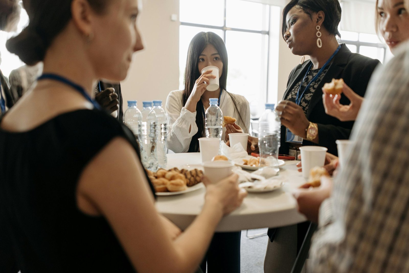 A Starbucks Coffee Traveler serving hot coffee into cups for a group at a business meeting or social event, highlighting its convenience, included items, and value for planning event budgets in 2025.