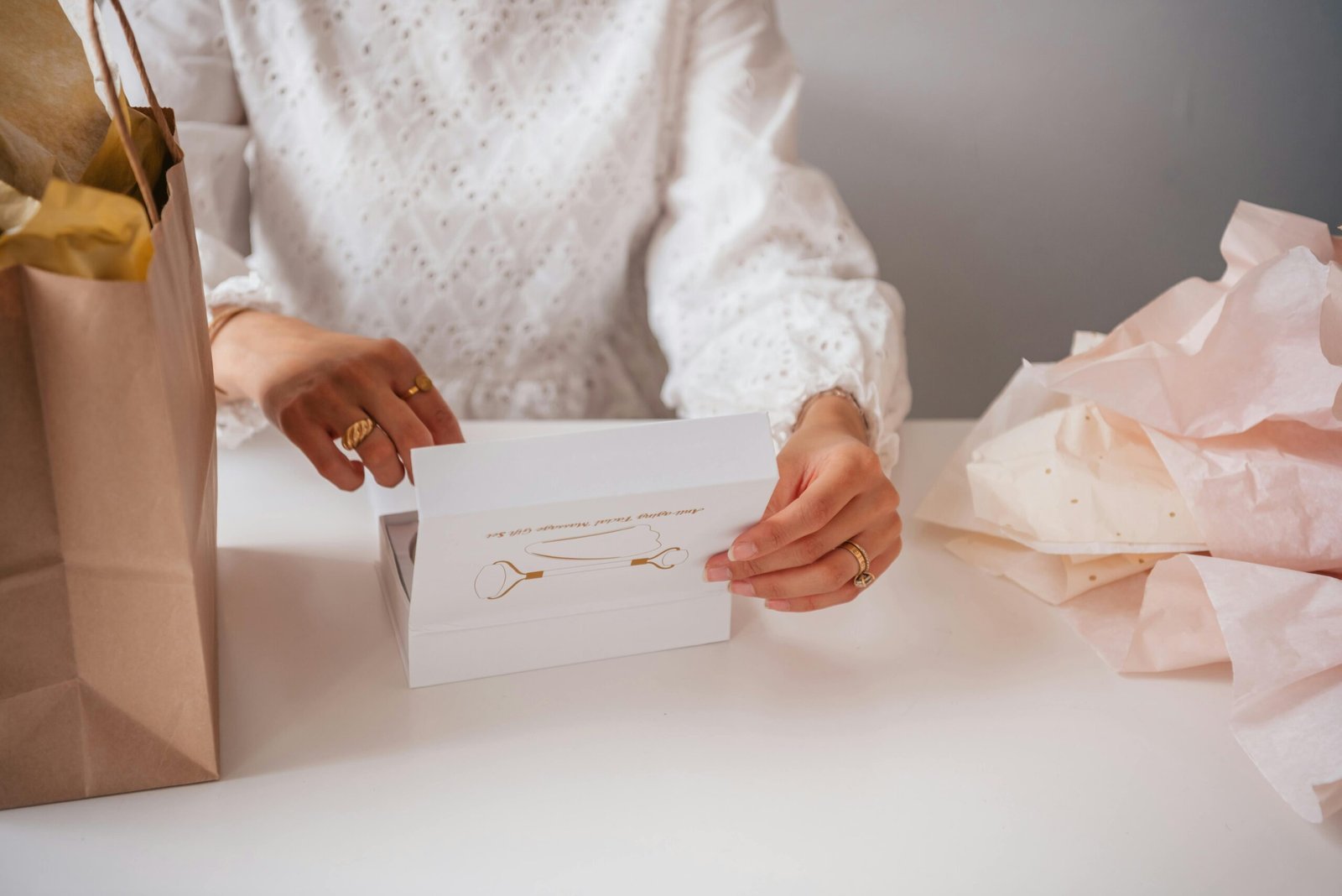Personalized travel jewelry case with initials, open and beautifully organized with various rings, earrings, and necklaces, representing elegant and secure accessory storage for travelers.