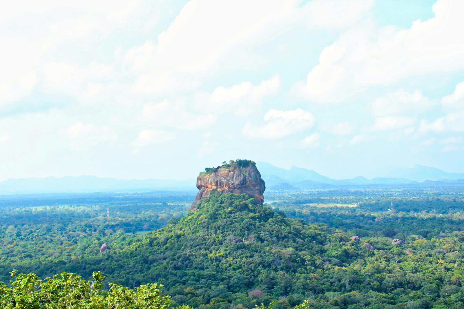 A panoramic view capturing Sri Lanka's stunning blend of ancient cultural sites, vibrant natural landscapes, and tranquil beaches, symbolizing unforgettable adventure travel experiences and customized tours offered by Tourstro.com.