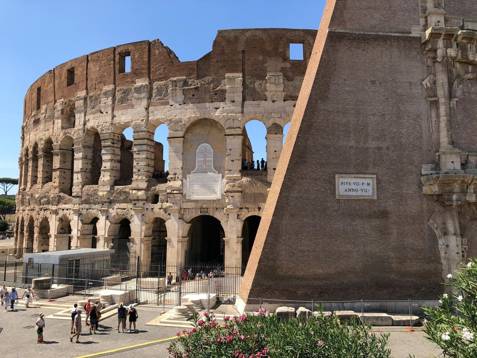 Panoramic view of Rome, Italy, featuring iconic landmarks like the Colosseum with smiling tourists, representing comprehensive Rome travel packages and easy vacation planning.
