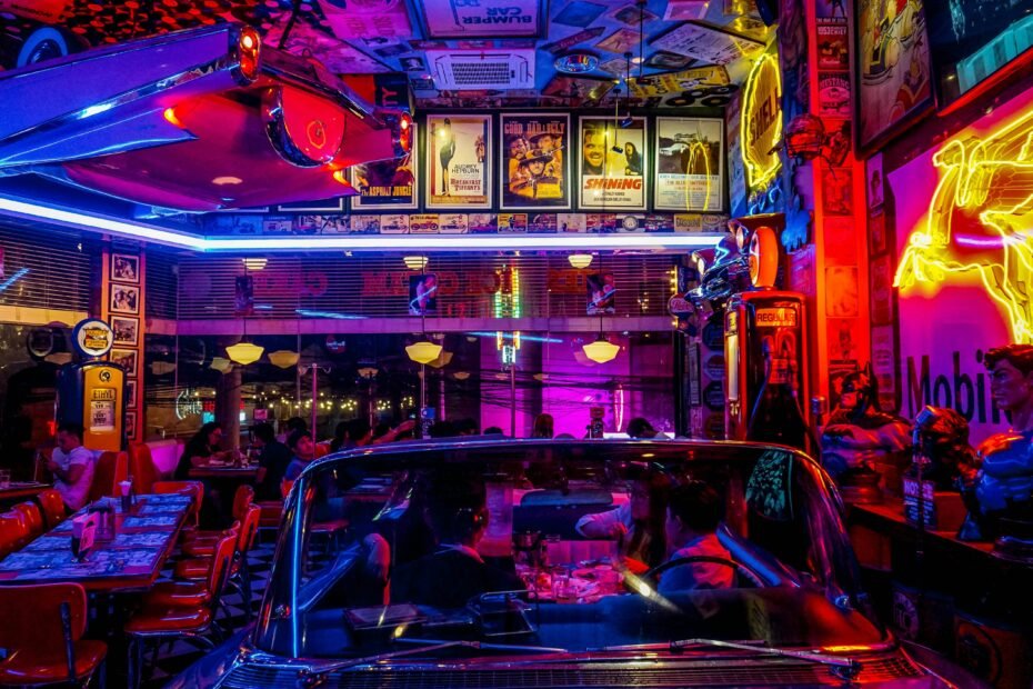Interior view of Whistle Stop at the American Cafe in Travelers Rest, SC, featuring train-themed decor, cozy ambiance, and patrons enjoying classic American comfort food.