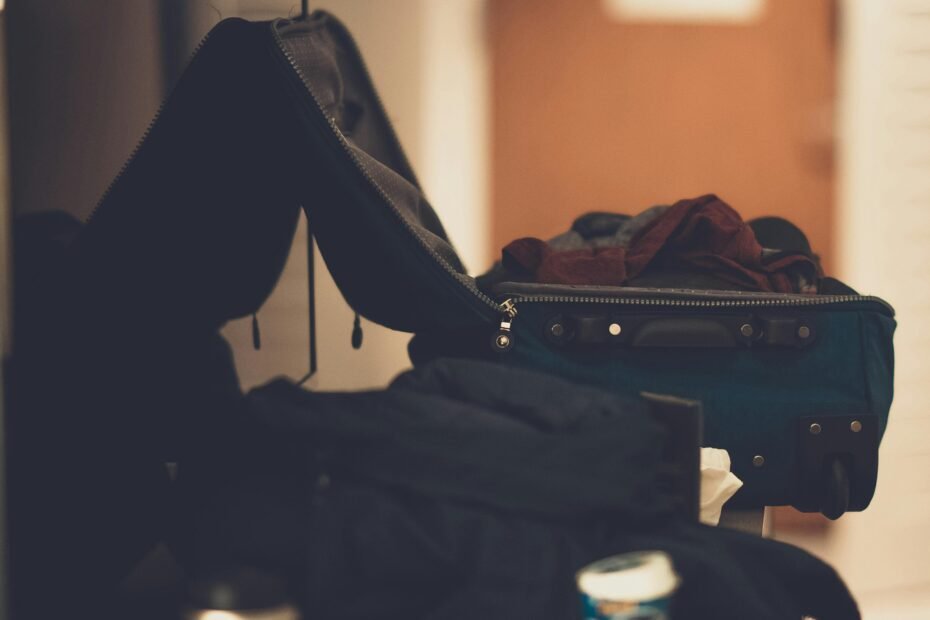 Travel laundry sack neatly separating dirty clothes from clean clothes in an organized suitcase, highlighting smart packing and hygiene for travelers.