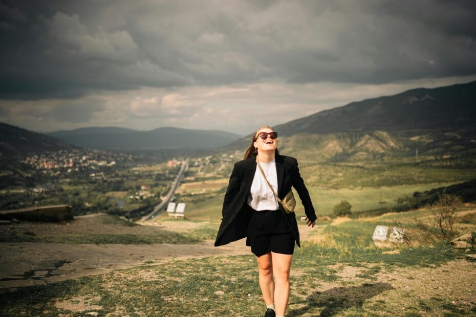Stylish traveler with a vibrant Hello Kitty rolling suitcase, symbolizing fun, practical, and joyful travel adventures.