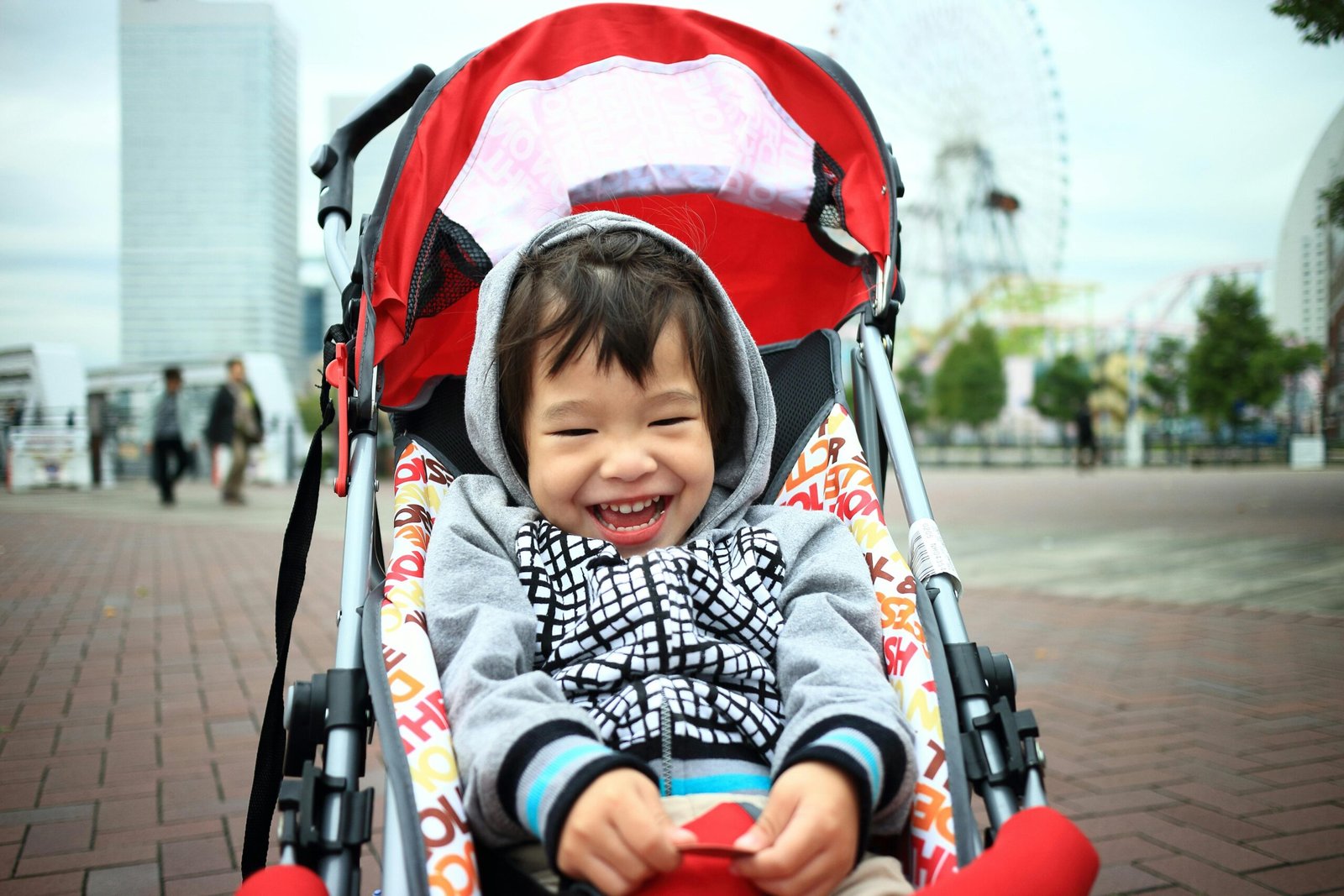 Happy family navigating an airport with a lightweight, compact travel stroller, showcasing the best pushchair for stress-free journeys with children.