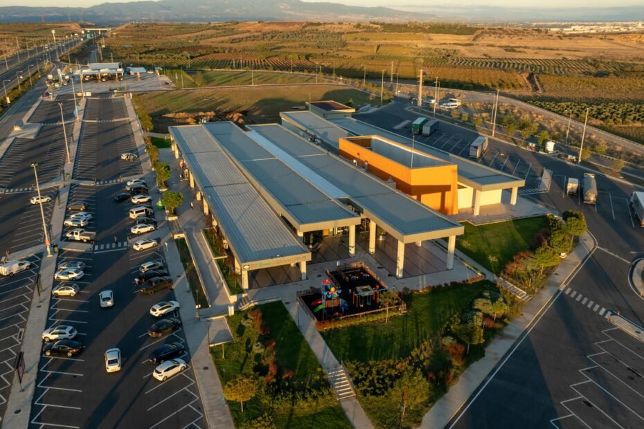 Flying J Dealer Town Pump Travel Center with fuel pumps, trucks, and cars, a reliable stop for professional drivers and road trippers offering extensive amenities.