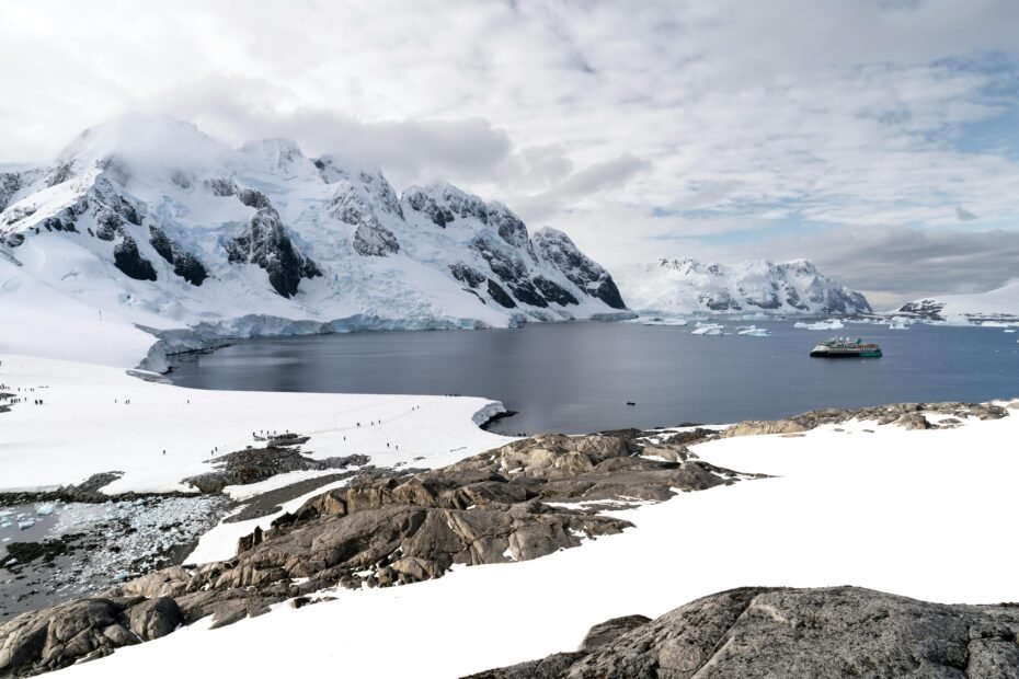 Most stable boat for cross-ocean travel: A large, robust full-displacement monohull or trawler yacht sailing smoothly on vast open waters, symbolizing safety, comfort, and seaworthiness for long-distance ocean adventures.