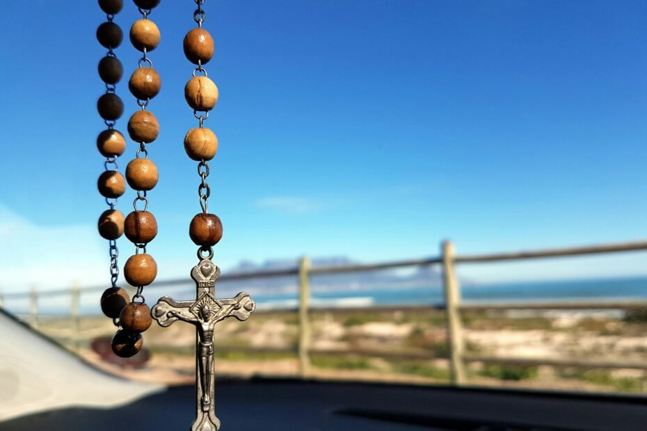 Hands clasped in prayer for travel safety, embodying peace, trust, and divine protection before a safe journey.