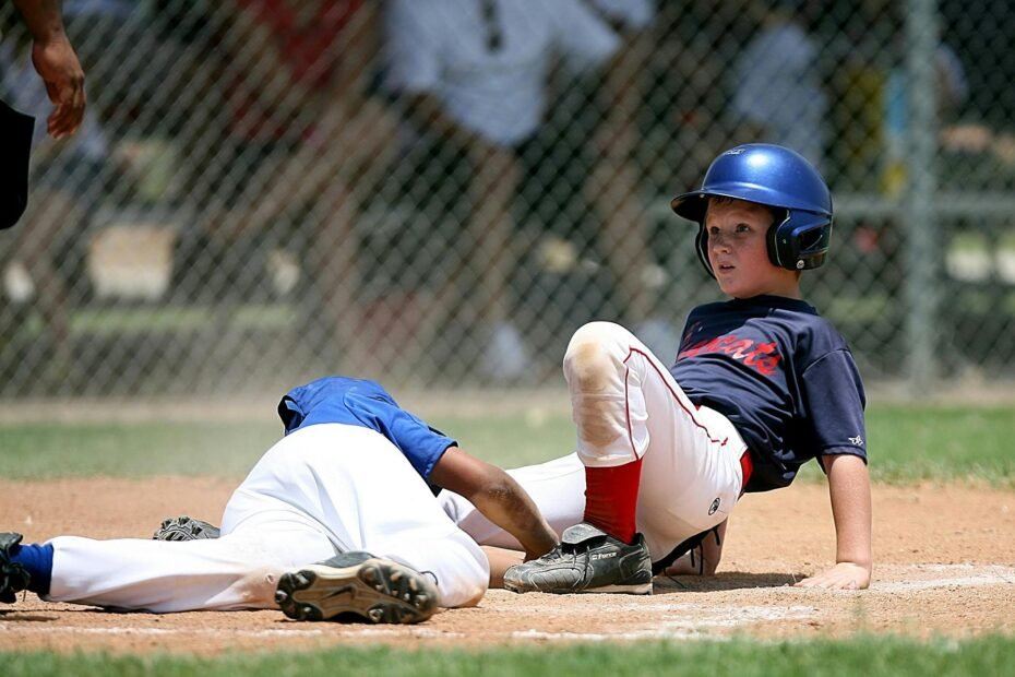 Young baseball players in action on a field, representing the competitive Aquasox travel baseball program focused on skill development and high-level play.