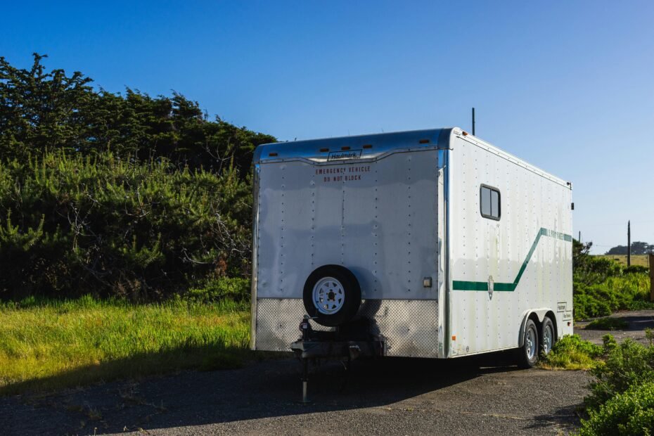 Travel trailer with robust ST tires on a highway, emphasizing safety, stability, and reliability for long road trips.