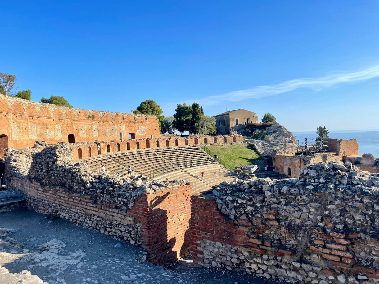 Ancient Greek temple ruins overlooking the picturesque Mediterranean Sea in Sicily, representing the best time to visit this Italian island for ideal weather, cultural exploration, and memorable holidays.