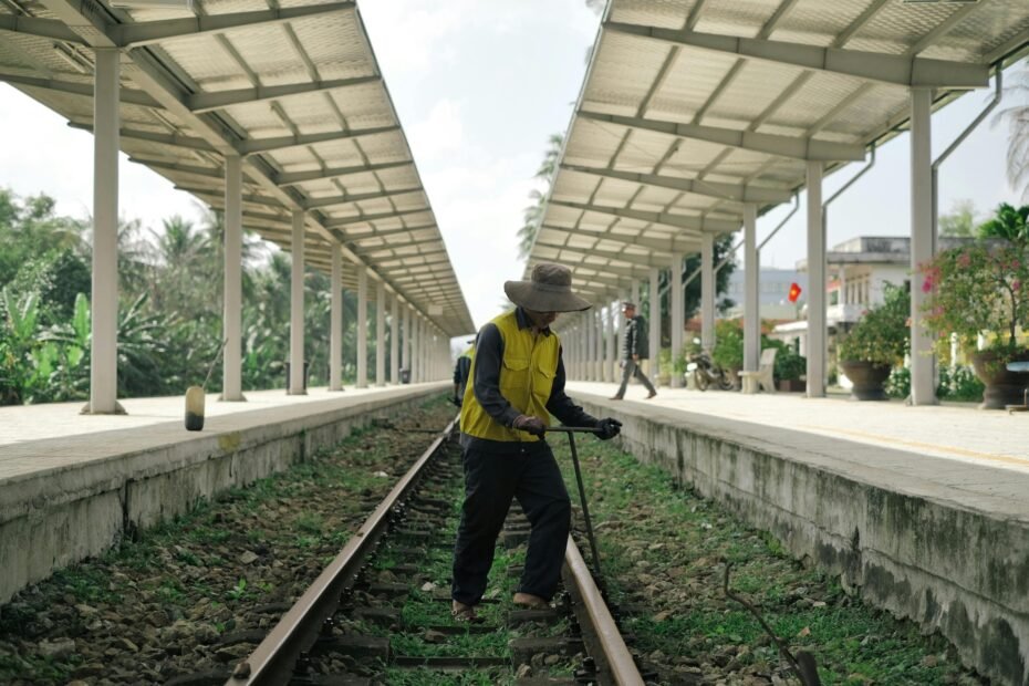 Skilled construction worker in safety gear standing on a vibrant project site, representing the adventure, financial rewards, and career growth of traveling construction jobs and per diem opportunities.