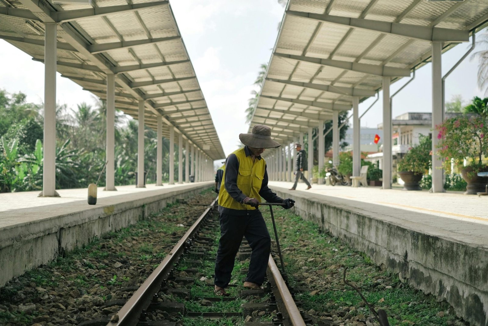 Skilled construction worker in safety gear standing on a vibrant project site, representing the adventure, financial rewards, and career growth of traveling construction jobs and per diem opportunities.