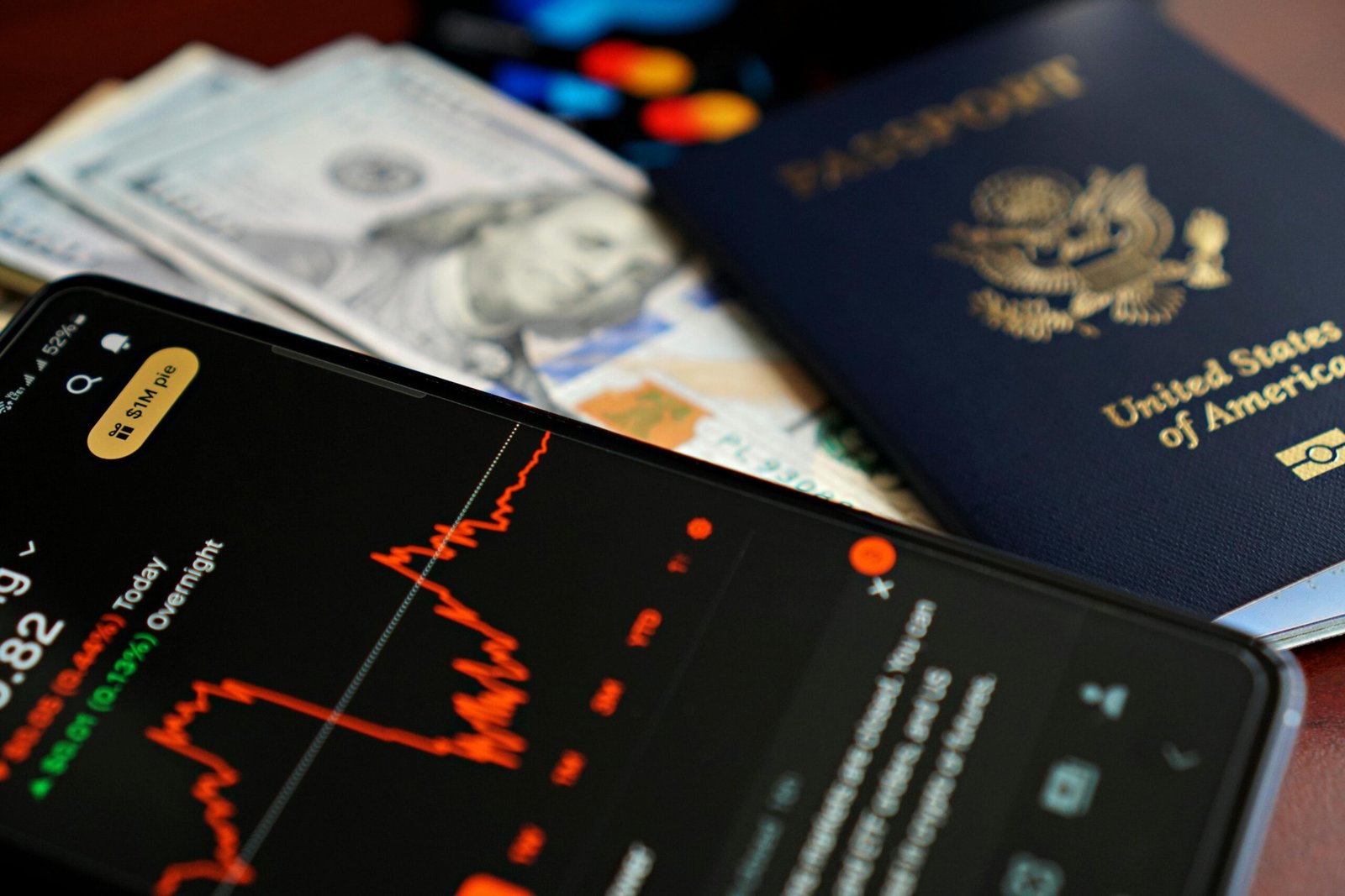 Traveler using smartphone to check data usage and manage connectivity abroad, estimating GB per day for worry-free travel.