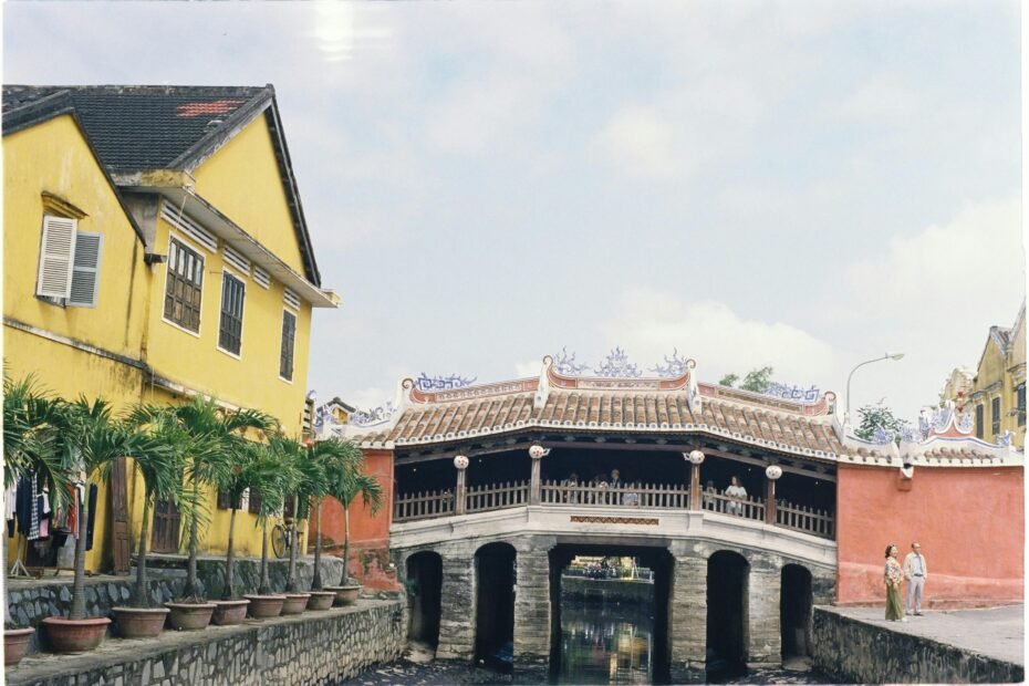 A captivating composite image showcasing iconic Vietnamese travel destinations including Ha Long Bay's karsts, Hoi An's lantern-lit streets, and vibrant Ho Chi Minh City, illustrating a diverse north-to-south itinerary.