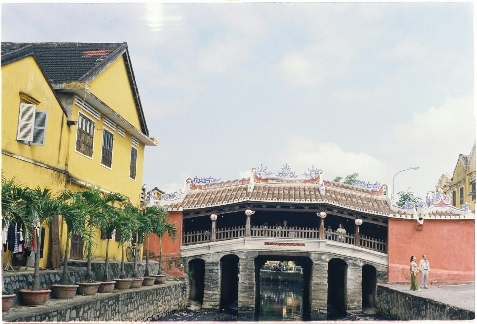 A captivating composite image showcasing iconic Vietnamese travel destinations including Ha Long Bay's karsts, Hoi An's lantern-lit streets, and vibrant Ho Chi Minh City, illustrating a diverse north-to-south itinerary.