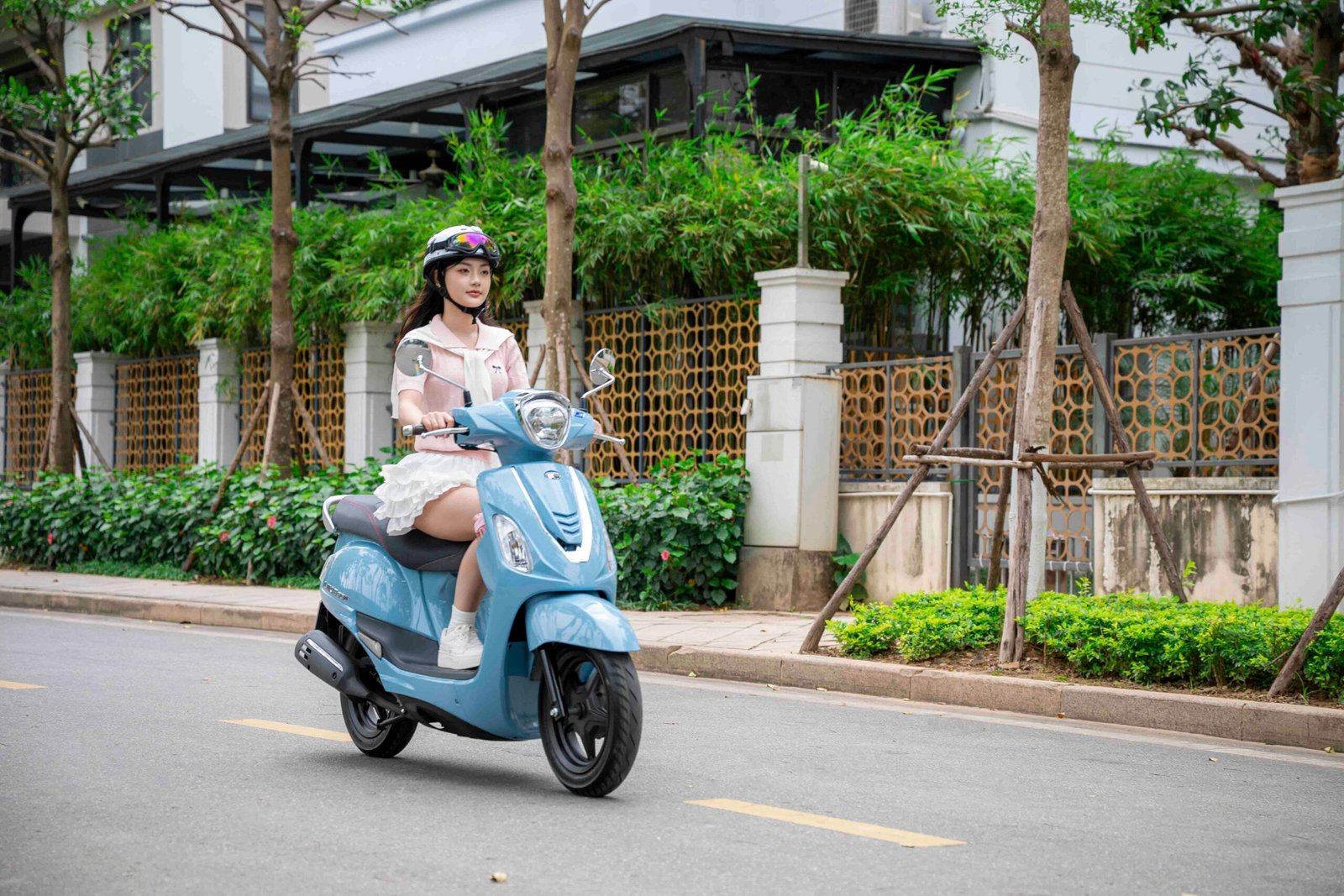 Person confidently riding a portable travel scoot, enjoying freedom and independence during travel and exploration.