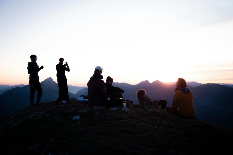 Smiling radiologic technologist with a travel backpack looking towards a vibrant city skyline, embodying the career flexibility and adventure of travel x-ray jobs.