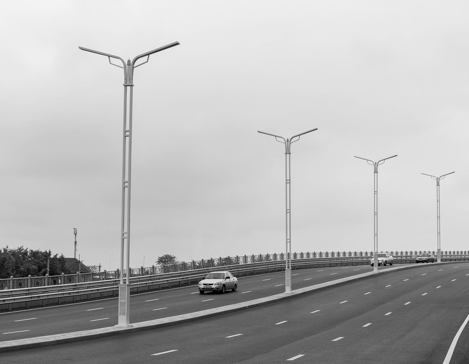 Modern highway travel plaza with gas pumps, commercial trucks, and passenger cars, welcoming travelers to the New Stanton Travel Plaza on the Pennsylvania Turnpike for a convenient break.