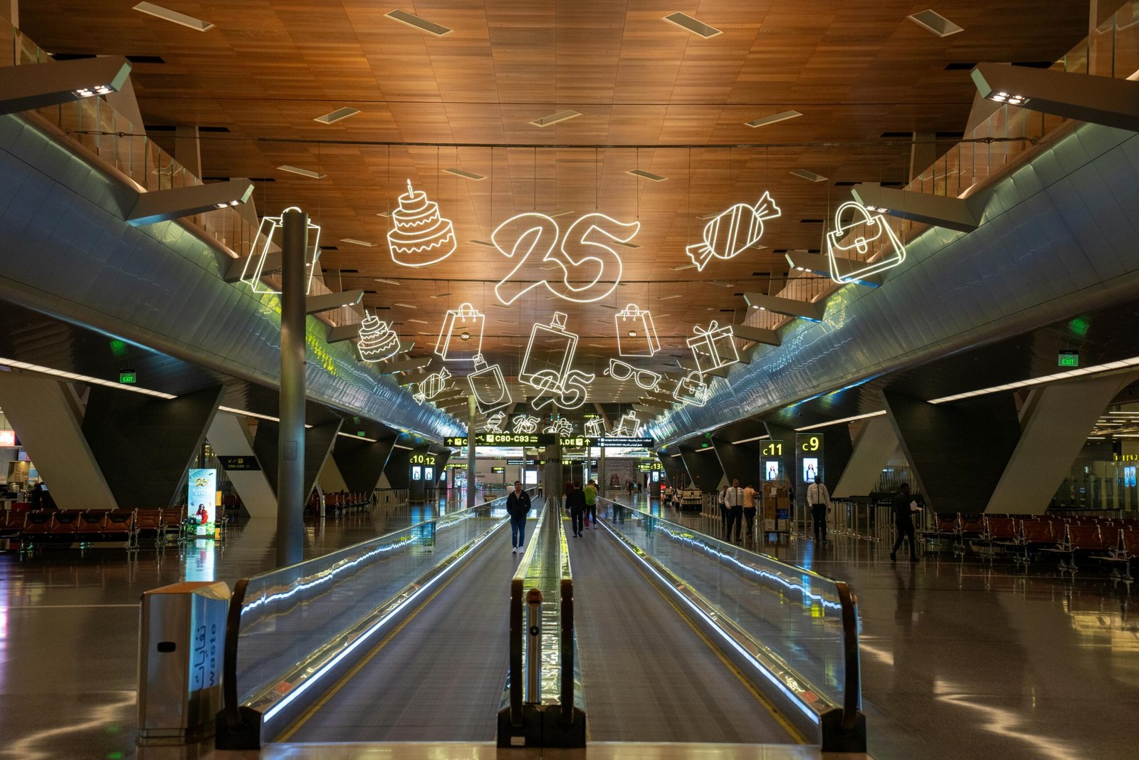 A durable hard case golf travel bag being transported through an airport terminal, highlighting secure protection for valuable golf clubs during air travel.