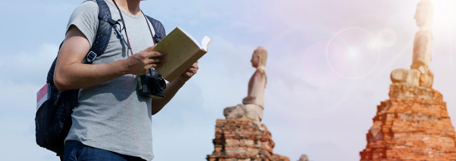 Adventurous traveling historian researching and documenting findings amidst majestic ancient ruins, symbolizing a career of historical exploration and discovery.